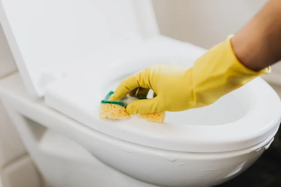 Water pooling around the base of a toilet